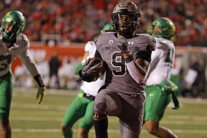 Nov 20, 2021; Salt Lake City, Utah, USA; Utah Utes running back Tavion Thomas (9) runs for a touchdown in the third quarter against the Oregon Ducks at Rice-Eccles Stadium. Mandatory Credit: Jeffrey Swinger-USA TODAY Sports