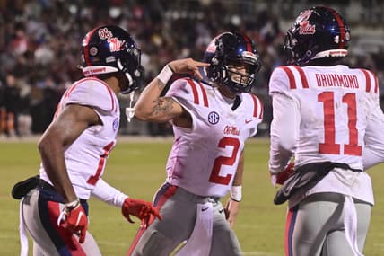 Nov 25, 2021; Starkville, Mississippi, USA; Mississippi Rebels quarterback Matt Corral (2) reacts after scoring a touchdown against the Mississippi State Bulldogs during the fourth quarter at Davis Wade Stadium at Scott Field. Mandatory Credit: Matt Bush-USA TODAY Sports