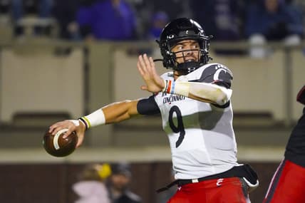 Nov 26, 2021; Greenville, North Carolina, USA; Cincinnati Bearcats quarterback Desmond Ridder (9) throws the ball during the second half against the East Carolina Pirates at Dowdy-Ficklen Stadium. Mandatory Credit: James Guillory-USA TODAY Sports