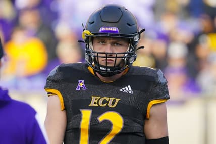 Nov 26, 2021; Greenville, North Carolina, USA;  East Carolina Pirates quarterback Holton Ahlers (12) looks on during the first half against the Cincinnati Bearcats at Dowdy-Ficklen Stadium. Mandatory Credit: James Guillory-USA TODAY Sports