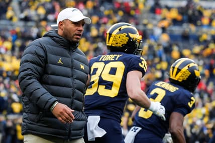 Michigan offensive coordinator Josh Gattis watches warmups before the Ohio State game at Michigan Stadium in Ann Arbor on Saturday, Nov. 27, 2021.