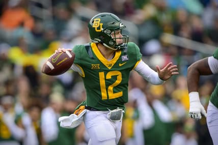 Nov 27, 2021; Waco, Texas, USA; Baylor Bears quarterback Blake Shapen (12) rolls out to pass against the Texas Tech Red Raiders during the first half at McLane Stadium. Mandatory Credit: Jerome Miron-USA TODAY Sports