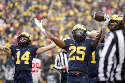 Michigan running back Hassan Haskins (25) celebrates  scoring a touchdown against Ohio State during the second half at Michigan Stadium in Ann Arbor on Saturday, Nov. 27, 2021.

michigan happy