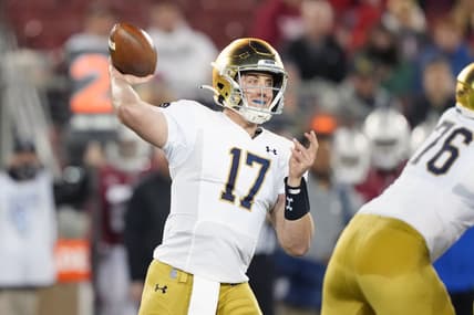 Nov 27, 2021; Stanford, California, USA; Notre Dame Fighting Irish quarterback Jack Coan (17) throws a pass during the third quarter against the Stanford Cardinal at Stanford Stadium. Mandatory Credit: Darren Yamashita-USA TODAY Sports
