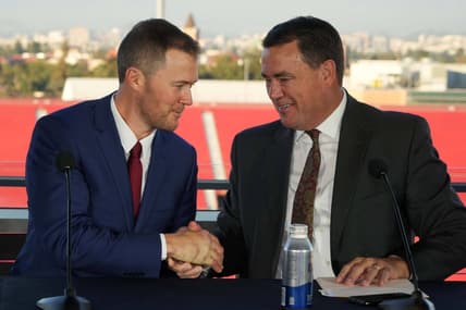 Nov 29, 2021; Los Angeles, CA, USA; Lincoln Riley (left) and Southern California Trojans athletic director Mike Bohn shake hands during a press conference to introduce Riley as USC head coach at the Los Angeles Memorial Coliseum. Mandatory Credit: Kirby Lee-USA TODAY Sports