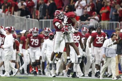 Dec 4, 2021; Atlanta, GA, USA; Alabama Crimson Tide defensive back Jordan Battle (9) celebrates with tight end Jahleel Billingsley (19) after an interception return for a touchdown against the Georgia Bulldogs in the second half during the SEC championship game at Mercedes-Benz Stadium. Mandatory Credit: Brett Davis-USA TODAY Sports