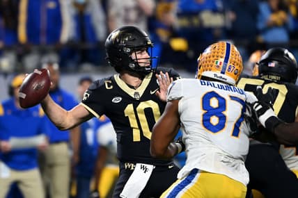 Dec 4, 2021; Charlotte, NC, USA; DWake Forest Demon Deacons quarterback Sam Hartman (10) looks to pass as Pittsburgh Panthers defensive lineman Habakkuk Baldonado (87) pressures in the second quarter of the ACC championship game at Bank of America Stadium. Mandatory Credit: Bob Donnan-USA TODAY Sports