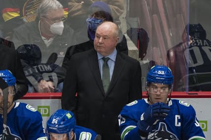 Dec 6, 2021; Vancouver, British Columbia, CAN; Vancouver Canucks head coach Bruce Boudreau on the bench during a game against the Los Angeles Kings in the first period at Rogers Arena. Mandatory Credit: Bob Frid-USA TODAY Sports