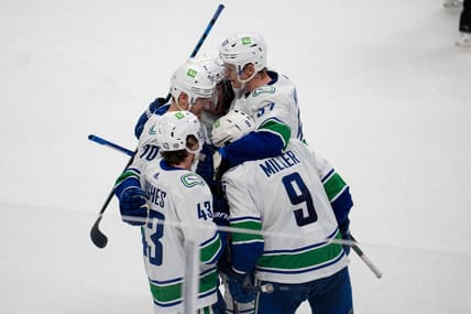 Dec 16, 2021; San Jose, California, USA; Vancouver Canucks center J.T. Miller (9), defenseman Quinn Hughes (43), defenseman Tyler Myers (57) and left wing Tanner Pearson (70) celebrate after a goal during the third period against the San Jose Sharksat SAP Center at San Jose. Mandatory Credit: Neville E. Guard-USA TODAY Sports