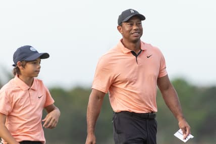 Dec 18, 2021; Orlando, Florida, USA; Tiger Woods walks off 18th green during the first round of the PNC Championship golf tournament at Grande Lakes Orlando Course. Mandatory Credit: Jeremy Reper-USA TODAY Sports