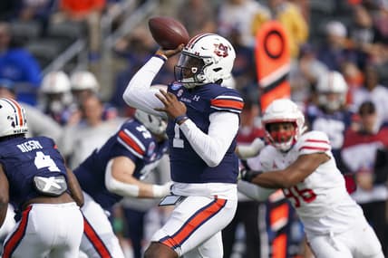 Dec 28, 2021; Birmingham, Alabama, USA; Auburn Tigers quarterback TJ Finley (1) passes against the Houston Cougars during the first half of the 2021 Birmingham Bowl at Protective Stadium. Mandatory Credit: Marvin Gentry-USA TODAY Sports