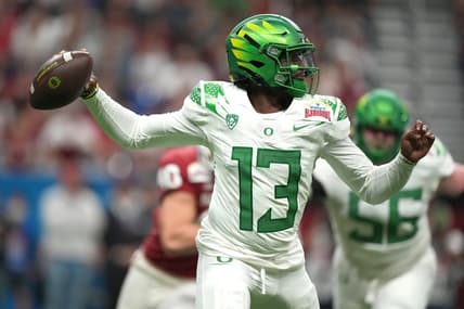 Dec 29, 2021; San Antonio, Texas, USA; Oregon Ducks quarterback Anthony Brown (13) throws the ball against the Oklahoma Sooners in the first half of the 2021 Alamo Bowl at Alamodome. Mandatory Credit: Kirby Lee-USA TODAY Sports