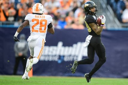 Purdue wide receiver Broc Thompson (29) catches a pass as Tennessee defensive back De'Shawn Rucker (28) defends at the 2021 Music City Bowl NCAA college football game at Nissan Stadium in Nashville, Tenn. on Thursday, Dec. 30, 2021.

Kns Tennessee Purdue