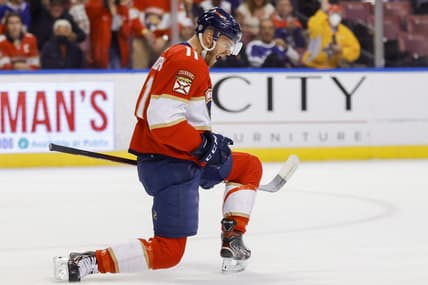 Dec 30, 2021; Sunrise, Florida, USA; Florida Panthers left wing Jonathan Huberdeau (11) celebrates after scoring against the Tampa Bay Lightning during the first period at FLA Live Arena. Mandatory Credit: Sam Navarro-USA TODAY Sports