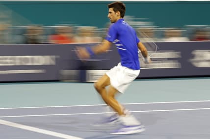 Mar 22, 2019; Miami Gardens, FL, USA; Novak Djokovic of Serbia hits a forehand against Bernard Tomic of Australia (not pictured) in the second round of the Miami Open at Miami Open Tennis Complex. Mandatory Credit: Geoff Burke-USA TODAY Sports