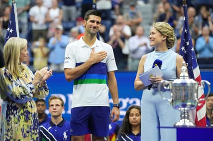 Sep 12, 2021; Flushing, NY, USA; Novak Djokovic of Serbia acknowledges the crowd during an interview with ESPN host Chris McKendry (R) during the trophy ceremony after his match against Daniil Medvedev of Russia (not pictured) in the men's singles final on day fourteen of the 2021 U.S. Open tennis tournament at USTA Billie Jean King National Tennis Center. Mandatory Credit: Danielle Parhizkaran-USA TODAY Sports