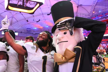 Oct 9, 2021; Syracuse, New York, USA; Wake Forest Demon Deacons running back Christian Beal-Smith (1) poses for a photo with mascot Demon Deacon following the game against the Syracuse Orange at the Carrier Dome. Mandatory Credit: Rich Barnes-USA TODAY Sports