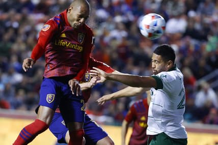 Nov 3, 2021; Sandy, Utah, USA; Real Salt Lake midfielder Everton Luiz (25) heads the ball for a shot against Portland Timbers defender Bill Tuiloma (25) in the first half at Rio Tinto Stadium. Mandatory Credit: Jeffrey Swinger-USA TODAY Sports
