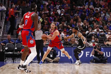 Nov 5, 2021; Detroit, Michigan, USA; Detroit Pistons forward Kelly Olynyk (13) is defended by Brooklyn Nets forward Bruce Brown (1) during the second quarter at Little Caesars Arena. Mandatory Credit: Raj Mehta-USA TODAY Sports