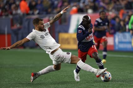Nov 7, 2021; Foxborough, Massachusetts, USA; Inter Miami defender Leandro Gonzalez (6) stops New England Revolution midfielder Ema Boateng (11) during the second half at Gillette Stadium. Mandatory Credit: Winslow Townson-USA TODAY Sports