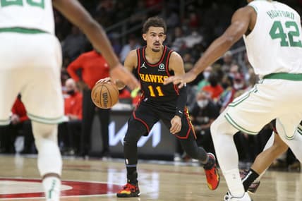 Nov 17, 2021; Atlanta, Georgia, USA; Atlanta Hawks guard Trae Young (11) dribbles against the Boston Celtics in the second quarter at State Farm Arena. Mandatory Credit: Brett Davis-USA TODAY Sports