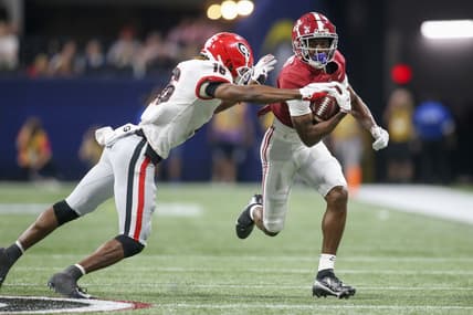 Dec 4, 2021; Atlanta, GA, USA; Alabama Crimson Tide wide receiver Ja'Corey Brooks (7) is tackled by Georgia Bulldogs defensive back Lewis Cine (16) in the second half during the SEC championship game at Mercedes-Benz Stadium. Mandatory Credit: Brett Davis-USA TODAY Sports