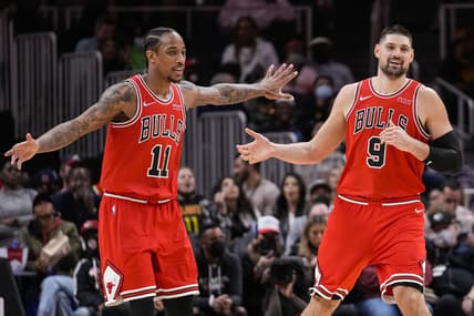 Dec 27, 2021; Atlanta, Georgia, USA; Chicago Bulls forward DeMar DeRozan (11) and center Nikola Vucevic (9) react after a basket against the Atlanta Hawks during the second half at State Farm Arena. Mandatory Credit: Dale Zanine-USA TODAY Sports
