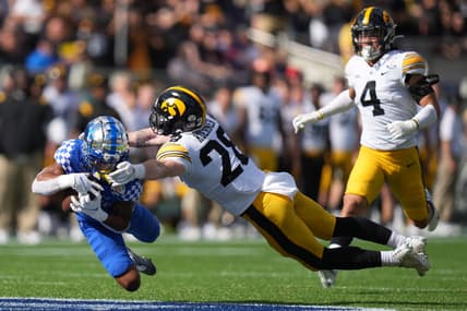 Jan 1, 2022; Orlando, FL, USA; Kentucky Wildcats wide receiver Wan'Dale Robinson (1) makes a diving catch against Iowa Hawkeyes defensive back Jack Koerner (28) during first half in the 2022 Citrus Bowl at Camping World Stadium. Mandatory Credit: Jasen Vinlove-USA TODAY Sports