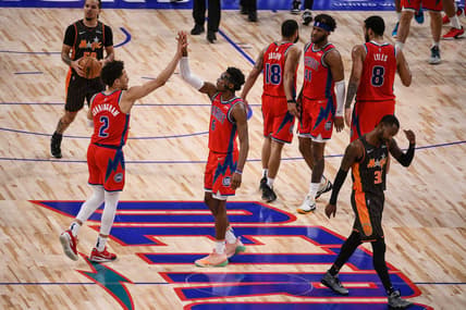 Jan 8, 2022; Detroit, Michigan, USA; Detroit Pistons guard Cade Cunningham (2) and guard Hamidou Diallo (6) high five as Orlando Magic guard Terrence Ross (31) walks back to the bench during the fourth quarter at Little Caesars Arena. Mandatory Credit: Tim Fuller-USA TODAY Sports