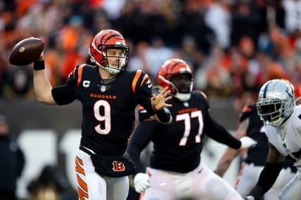 Jan 15, 2022; Cincinnati, OH, USA;  Cincinnati Bengals quarterback Joe Burrow (9) throws for a first down in the first half the AFC wild card game between the Cincinnati Bengals and the Las Vegas Raiders on Saturday, Jan. 15, 2022, at Paul Brown Stadium in Cincinnati. Mandatory Credit: Albert Cesare-USA TODAY Sports