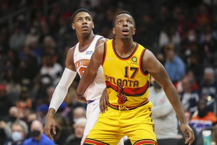 Jan 15, 2022; Atlanta, Georgia, USA; Atlanta Hawks forward Onyeka Okongwu (17) boxes out New York Knicks guard RJ Barrett (9) in the first quarter at State Farm Arena. Mandatory Credit: Brett Davis-USA TODAY Sports