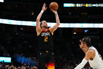 Jan 16, 2022; Denver, Colorado, USA; Utah Jazz guard Joe Ingles (2) shoots the ball over Denver Nuggets forward Aaron Gordon (50) in the second quarter at Ball Arena. Mandatory Credit: Ron Chenoy-USA TODAY Sports