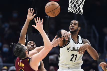 Jan 17, 2022; Cleveland, Ohio, USA; Brooklyn Nets center LaMarcus Aldridge (21) blocks the shot of Cleveland Cavaliers forward Kevin Love (0) during the first half at Rocket Mortgage FieldHouse. Mandatory Credit: Ken Blaze-USA TODAY Sports