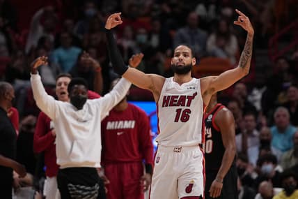 Jan 19, 2022; Miami, Florida, USA; Miami Heat forward Caleb Martin (16) gestures after the three point shot made by guard Gabe Vincent (not pictured) during the first half against the Portland Trail Blazers at FTX Arena. Mandatory Credit: Jasen Vinlove-USA TODAY Sports
