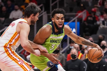 Jan 19, 2022; Atlanta, Georgia, USA; Minnesota Timberwolves center Karl-Anthony Towns (32) dribbles against Atlanta Hawks forward Danilo Gallinari (8) during the first half at State Farm Arena. Mandatory Credit: Dale Zanine-USA TODAY Sports