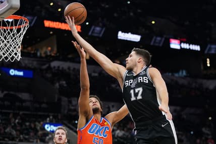 Jan 19, 2022; San Antonio, Texas, USA;  San Antonio Spurs forward Doug McDermott (17) shoots over Oklahoma City Thunder forward Jeremiah Robinson-Earl (50) in the first half at the AT&T Center. Mandatory Credit: Daniel Dunn-USA TODAY Sports