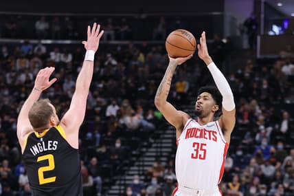 Jan 19, 2022; Salt Lake City, Utah, USA; Houston Rockets center Christian Wood (35) makes a three point basket over Utah Jazz guard Joe Ingles (2) in the first quarter at Vivint Arena. Mandatory Credit: Rob Gray-USA TODAY Sports