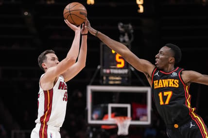 Jan 21, 2022; Atlanta, Georgia, USA; Miami Heat guard Duncan Robinson (55) is fouled while shooting by Atlanta Hawks forward Onyeka Okongwu (17) during the first half at State Farm Arena. Mandatory Credit: Dale Zanine-USA TODAY Sports