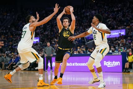 Jan 23, 2022; San Francisco, California, USA; Golden State Warriors forward Nemanja Bjelica (8) holds onto the ball between Utah Jazz center Rudy Gobert (27) and forward Rudy Gay (8) in the second quarter at the Chase Center. Mandatory Credit: Cary Edmondson-USA TODAY Sports