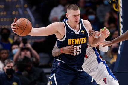 Jan 23, 2022; Denver, Colorado, USA; Denver Nuggets center Nikola Jokic (15) controls the ball against Detroit Pistons forward Saddiq Bey (41) in the fourth quarter at Ball Arena. Mandatory Credit: Isaiah J. Downing-USA TODAY Sports