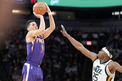 Jan 24, 2022; Phoenix, Arizona, USA; Phoenix Suns guard Devin Booker (1) shoots over Utah Jazz forward Danuel House Jr (25) during the second half at Footprint Center. Mandatory Credit: Joe Camporeale-USA TODAY Sports