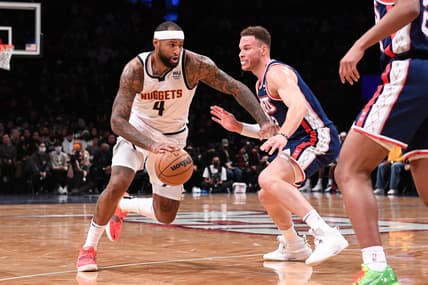Jan 26, 2022; Brooklyn, New York, USA;  Denver Nuggets Center DeMarcus Cousins (4) drives to the basket against Brooklyn Nets forward Blake Griffin (2) during the second quarter at Barclays Center. Mandatory Credit: Dennis Schneidler-USA TODAY Sports