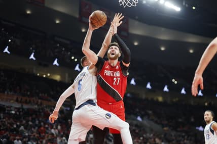 Jan 26, 2022; Portland, Oregon, USA; Portland Trail Blazers Center Jusuf Nurkic (27) is fouled while shooting by Dallas Mavericks center Kristaps Porzingis (6) during the first half at Moda Center. Mandatory Credit: Soobum Im-USA TODAY Sports