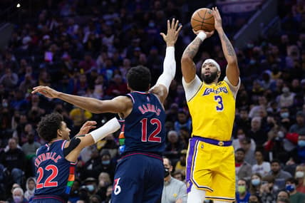 Jan 27, 2022; Philadelphia, Pennsylvania, USA; Los Angeles Lakers forward Anthony Davis (3) scores past Philadelphia 76ers forward Tobias Harris (12) and guard Matisse Thybulle (22) during the second quarter at Wells Fargo Center. Mandatory Credit: Bill Streicher-USA TODAY Sports