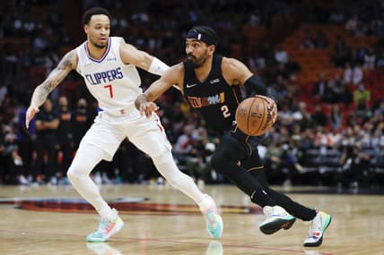 Jan 28, 2022; Miami, Florida, USA; Miami Heat guard Gabe Vincent (2) dribbles the basketball ahead of LA Clippers guard Amir Coffey (7) during the first quarter at FTX Arena. Mandatory Credit: Sam Navarro-USA TODAY Sports