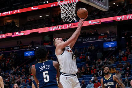 Jan 28, 2022; New Orleans, Louisiana, USA;  Denver Nuggets center Nikola Jokic (15) drives to the basket against New Orleans Pelicans forward Herbert Jones (5) during the first half at the Smoothie King Center. Mandatory Credit: Stephen Lew-USA TODAY Sports