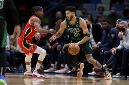 Jan 29, 2022; New Orleans, Louisiana, USA; Boston Celtics forward Jayson Tatum (0) dribbles the ball against New Orleans Pelicans guard Devonte' Graham (4) in the first quarter at the Smoothie King Center. Mandatory Credit: Chuck Cook-USA TODAY Sports