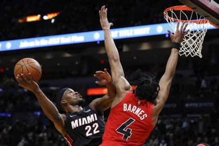 Jan 29, 2022; Miami, Florida, USA; Miami Heat forward Jimmy Butler (22) shoots the basketball over Toronto Raptors forward Scottie Barnes (4) during the second quarter at FTX Arena. Mandatory Credit: Sam Navarro-USA TODAY Sports