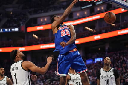 Jan 29, 2022; San Francisco, California, USA; Golden State Warriors forward Andrew Wiggins (22) dunks the ball against Brooklyn Nets guard Bruce Brown (1) in the first quarter at the Chase Center. Mandatory Credit: Cary Edmondson-USA TODAY Sports