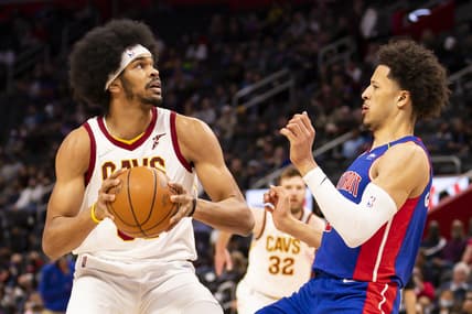 Jan 30, 2022; Detroit, Michigan, USA; Cleveland Cavaliers center Jarrett Allen (31) gets defended by Detroit Pistons guard Cade Cunningham (2) during the first quarter at Little Caesars Arena. Mandatory Credit: Raj Mehta-USA TODAY Sports